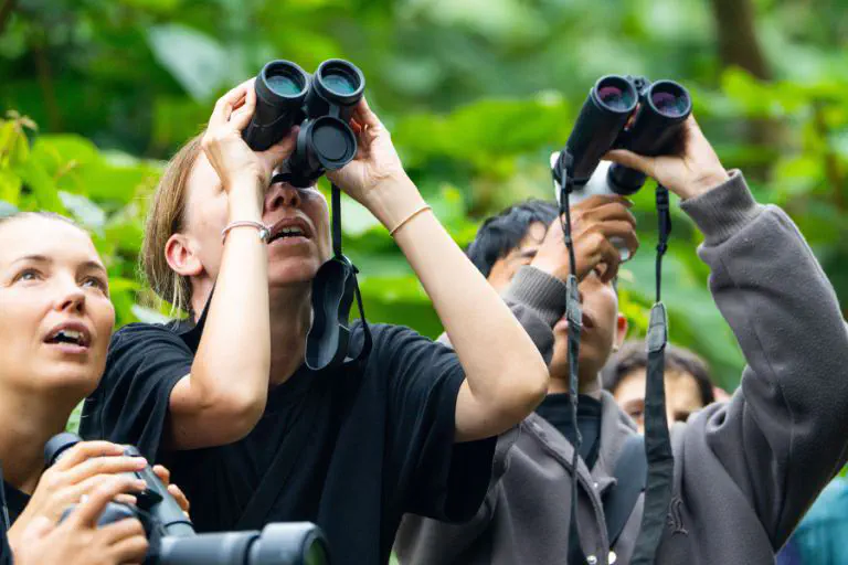 Group of birdwatchers with binoculars