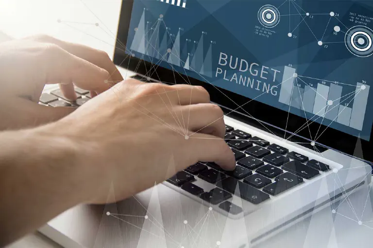 Employee implements budget planning on laptop