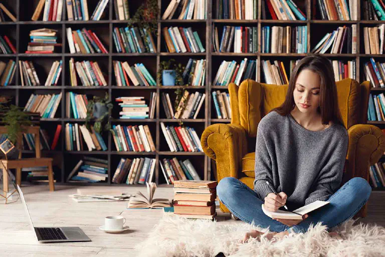 Woman catalogs her books with book app.
