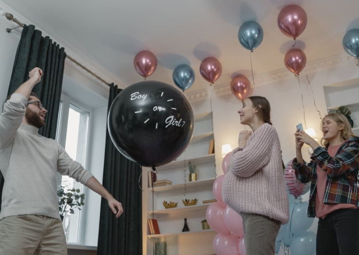 Use a large black balloon to keep the baby’s gender a secret until the last moment.