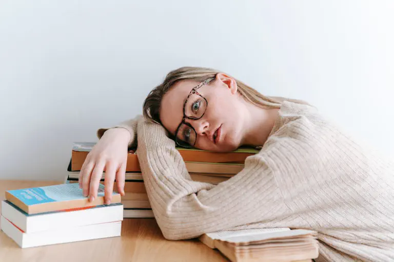 A student desperately tries to overcome her procrastination