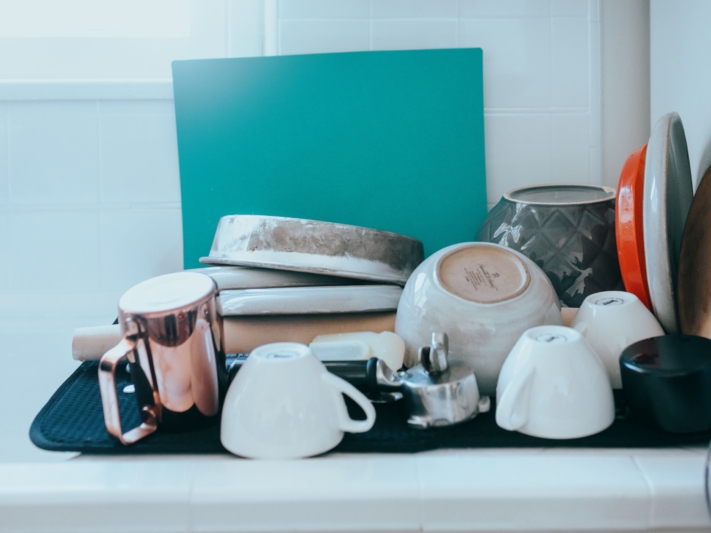 Dirty dishes accumulate quickly when there is no cleaning schedule and no one feels responsible.