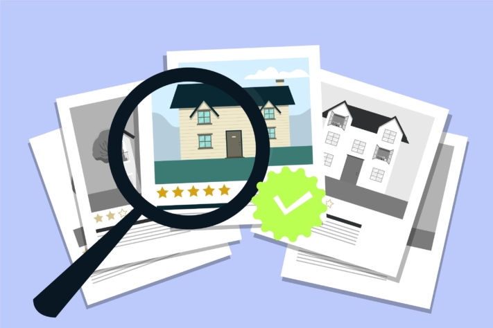 Magnifying glass over apartment ads